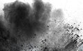 Abstract black dust explosion on white background. Royalty Free Stock Photo