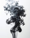 Abstract Black Ink Cloud Dissolving In Clear Water With Wispy Tendrils Against White Background Royalty Free Stock Photo