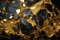 Abstract black shale stone volumetric texture with sparkling golden beauty elements and inclusions
