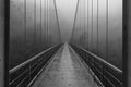 Black and white footbridge / bridge on a rainy, foggy day - vietnam Royalty Free Stock Photo