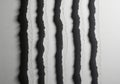 Abstract black and white vertical stripes with organic irregular edges creating texture and depth Royalty Free Stock Photo