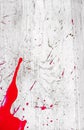 Abstract bloody scarlet stain on textured surface. Under the gun of a terrorist