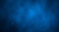 Abstract blue background with blurred white particles. Cosmic texture, night sky Royalty Free Stock Photo