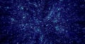 Abstract blue background of small round bokeh particles, beautiful holiday