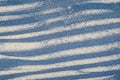 Abstract blue background with stripes. Close-up. Illustration. A striped snow background with shadows from the trees. Royalty Free Stock Photo