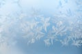 Abstract blue background with white frost crystals.