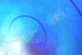 Abstract blue bokeh background. Blur white bright bokeh lights and underwater bubbles Royalty Free Stock Photo