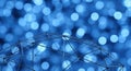 Abstract blue bokeh background with geometric mesh structure and soft blurred lights Royalty Free Stock Photo