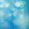 Abstract blue bokeh geometric background with bubbles and triangular polygons Royalty Free Stock Photo