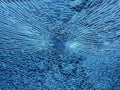 Abstract blue broken glass with a lot of cracks shot window against sky background