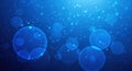 Abstract blue bubbles and light particles background Royalty Free Stock Photo