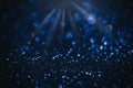 Abstract blue Christmas glowing background with shiny defocused lights, bokeh Royalty Free Stock Photo