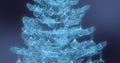 An abstract blue Christmas tree with decorations on a blue background Royalty Free Stock Photo