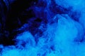 Abstract blue cloud pattern of white smoke on a black background. Royalty Free Stock Photo