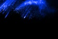 Abstract blue dust explosion on black background Royalty Free Stock Photo