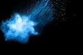 Abstract blue dust explosion on black background. Royalty Free Stock Photo