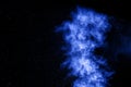 Abstract blue dust explosion on black background Royalty Free Stock Photo