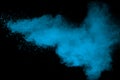 Abstract blue powder splattered on black background Royalty Free Stock Photo