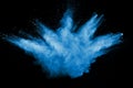 Abstract blue dust explosion on black background. Royalty Free Stock Photo