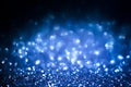 Abstract blue glitter background. Shiny glitter bokeh christmas background Royalty Free Stock Photo