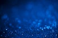 Abstract blue glitter background. Shiny glitter bokeh christmas background Royalty Free Stock Photo