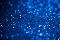 Abstract blue glitter background. Shiny glitter bokeh christmas background Royalty Free Stock Photo