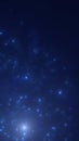 Abstract blue glowing particles floating in deep dark space representing cosmic dust and digital energy Royalty Free Stock Photo