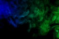 Abstract blue and green smoke hookah on a black background.