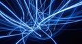 Abstract blue light trails streaking through darkness creating a dynamic energy flow Royalty Free Stock Photo