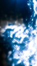 Abstract blue liquid-like burst of glowing light with bright reflections and soft blurred motion Royalty Free Stock Photo