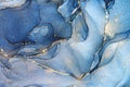 Abstract blue liquid watercolor background with golden stains. Cyan marble alcohol ink drawing effect. Turquoise geode