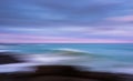 Abstract blue pink ocean sunset surf shoreline ICM blur streaked seascape