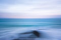 Abstract blue ocean sunset shoreline ICM blur streaked seascape