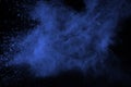 Abstract of blue powder explosion on black background. Blue powder splatted isolate. Colored cloud. Colored dust explode. Paint Ho Royalty Free Stock Photo