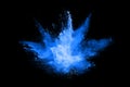 Abstract blue powder explosion on black background. Freeze motion.