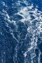 Abstract blue sea water with white waves. Blue sea texture with waves and foam. Mediterranean sea Royalty Free Stock Photo