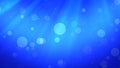 Abstract Blue Shiny Flying Glitter Dust And Circle Bokeh In The Wind With Burst Beam Light Royalty Free Stock Photo