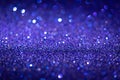 Abstract blue shiny glitter texture. Selective focus. Glowing surface, sparkle lights and bokeh effects. Christmas and Royalty Free Stock Photo