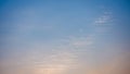 Abstract blue sky with beautiful wisp of cloud in sunset time, for use as a backing or backdrop Royalty Free Stock Photo