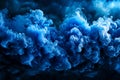 Abstract blue smoke cloud formation in a dark background creating a dramatic and ethereal visual effect perfect for artistic Royalty Free Stock Photo