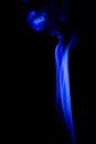 Abstract blue smoke swirls over black background Royalty Free Stock Photo