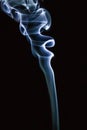 Abstract blue smoke swirls over black background Royalty Free Stock Photo