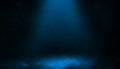 Abstract blue spotlight with smoke mist fog on a black background. Texture background for graphic and web Royalty Free Stock Photo