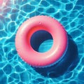 Abstract blue swimming pool water background with pink swimming pool ring float, top view Royalty Free Stock Photo