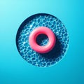 Abstract blue swimming pool water background with pink swimming pool ring float, top view Royalty Free Stock Photo