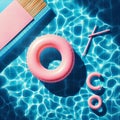 Abstract blue swimming pool water background with pink swimming pool ring float, top view Royalty Free Stock Photo