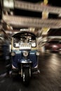 Abstract Blue Tuk Tuk with zoom blurred background, Thai traditional taxi