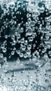 Abstract Blue water bubbles background. Bubbles underwater texture . Close-up soda water bubbles. Vertical background Royalty Free Stock Photo