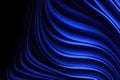 Abstract blue waves flowing smoothly across a dark textured background with subtle light effects Royalty Free Stock Photo