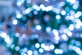 Abstract blue and white bokeh festoon on a dark green background. Bokeh from cold light garland on a Christmas tree Royalty Free Stock Photo